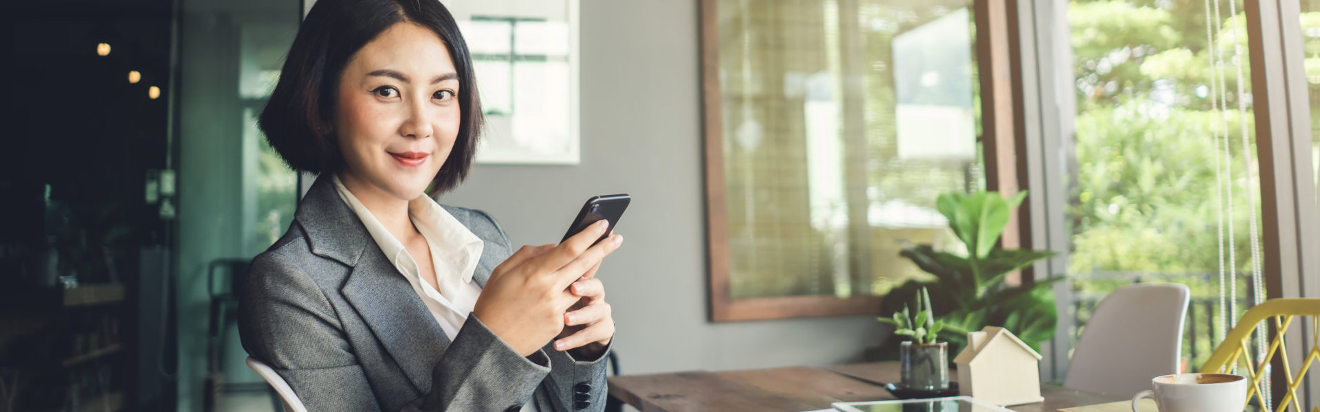 businesswoman working and holding smartphone